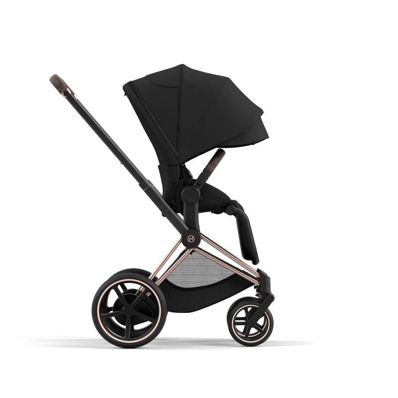 Black baby stroller with rose gold accents on a white background