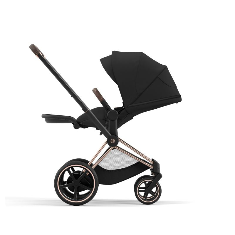 Black stroller with rose gold accents on a white background